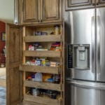 a custom pantry in a large kitchen cabinet